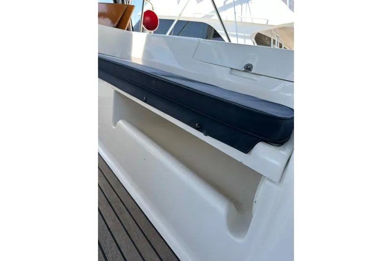 Slide: The Image of Beneteau 50 yacht deck seating area, 2000 model, featuring sleek design and comfortable cushions. - 62