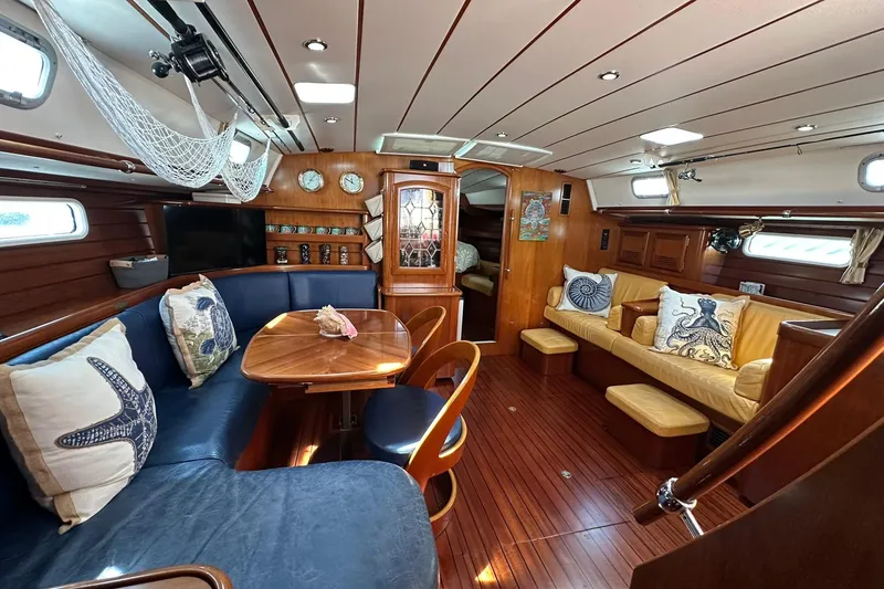 Slide: The Image of Luxurious interior of a 2000 Beneteau 50 yacht with elegant wood finishes and nautical decor. - 69