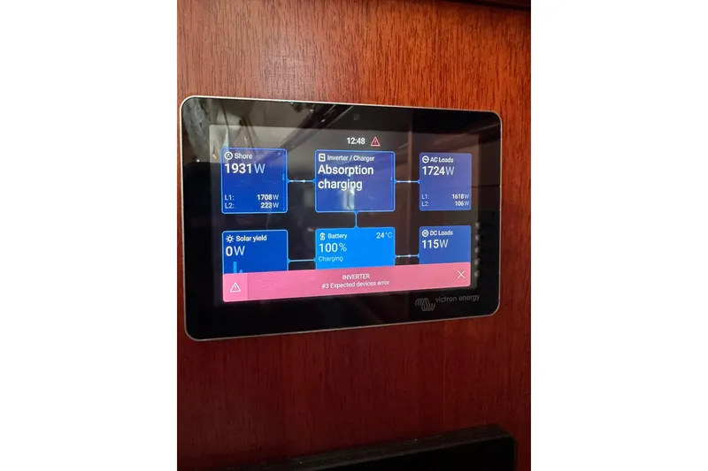 Slide: The Image of Touchscreen display on a 2000 Beneteau 50 yacht showing energy management data. - 72