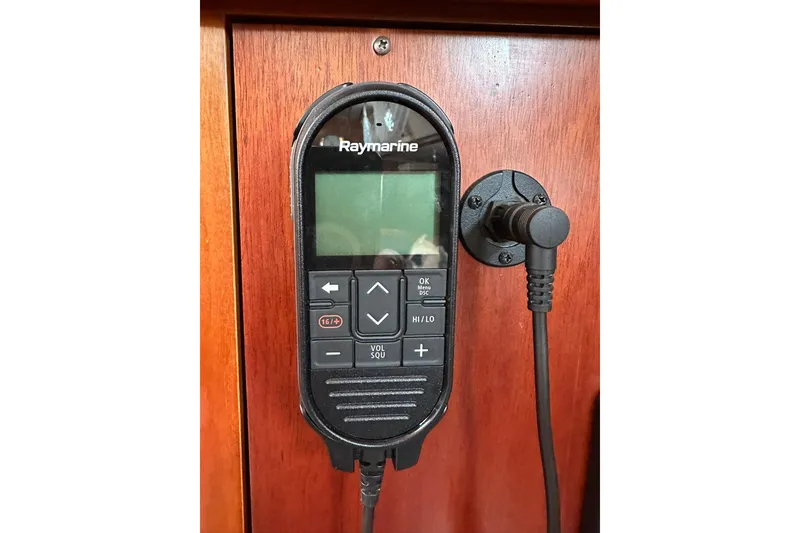 Slide: The Image of Raymarine marine radio on 2000 Beneteau 50 yacht, mounted on wooden panel. - 73