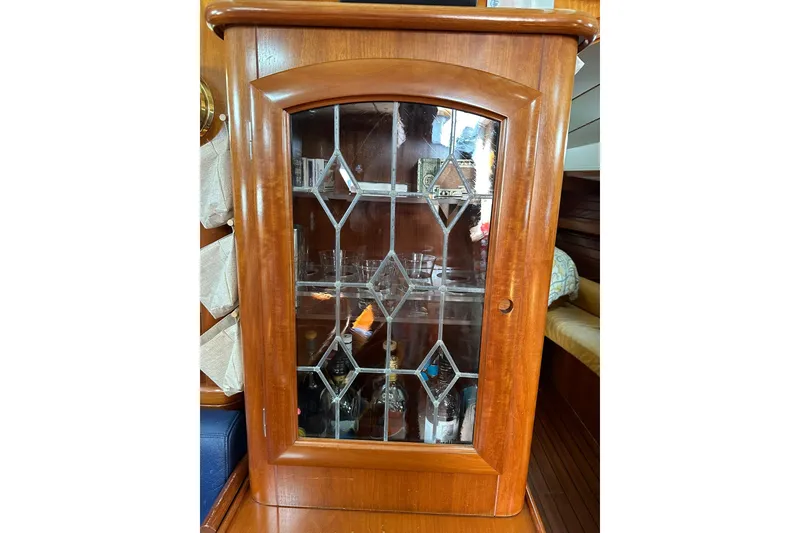 Slide: The Image of Wooden cabinet with glass door on a 2000 Beneteau 50 yacht interior. - 74