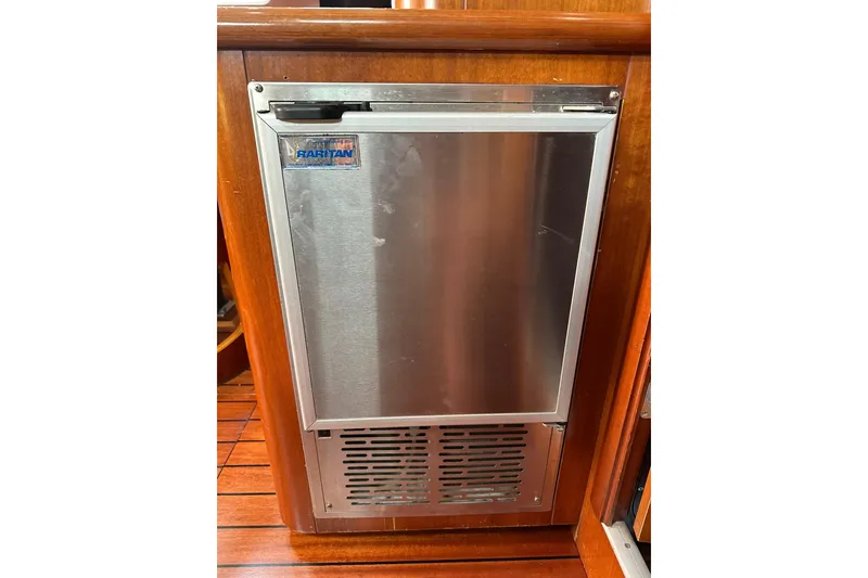 Slide: The Image of Stainless steel refrigerator on 2000 Beneteau 50 yacht, wooden interior. - 75