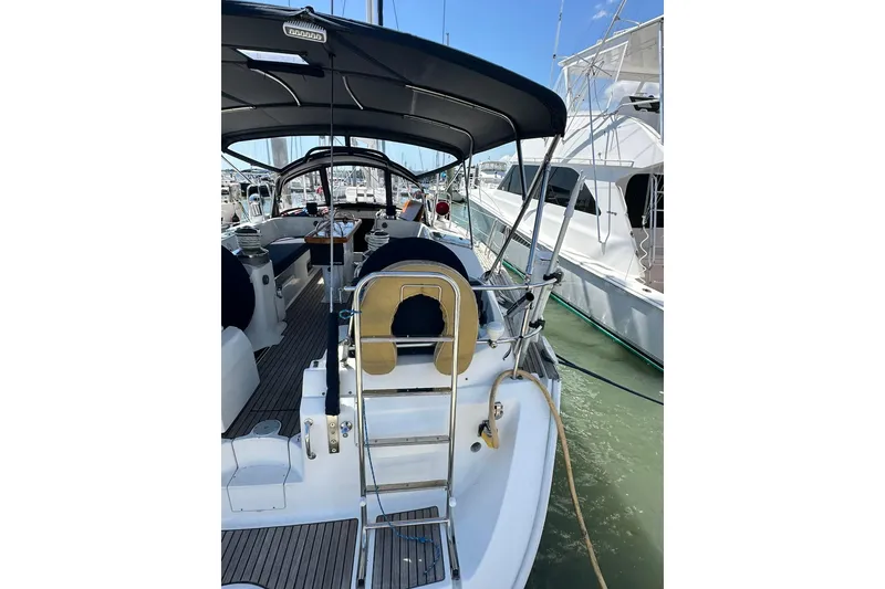 Slide: The Image of Sailing yacht Beneteau 50, 2000 model, docked at marina with covered cockpit. - 8