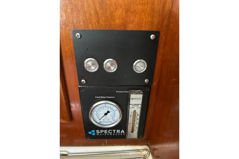 Slide: The Image of Spectra watermaker control panel on 2000 Beneteau 50 yacht, featuring pressure gauge and flow meter. - 85
