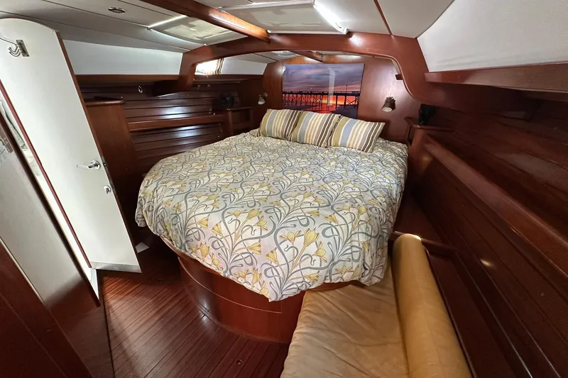 Slide: The Image of Luxurious cabin interior of a 2000 Beneteau 50 yacht with elegant wood finish. - 92