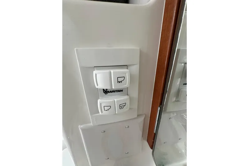 Slide: The Image of Control panel on a 2000 Beneteau 50 yacht, featuring Raritan switches. - 97