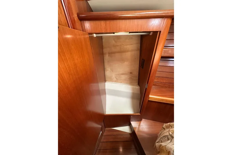 Slide: The Image of Wooden interior storage compartment on a 2000 Beneteau 50 yacht. - 99
