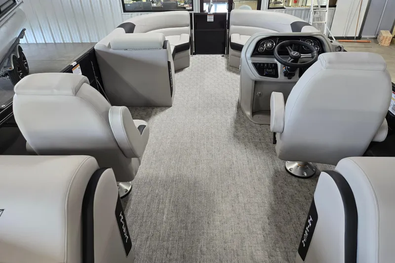 Slide: The Image of Luxurious interior of 2026 Trifecta 24RF LE 2.75 pontoon boat with plush seating and modern helm. - 11