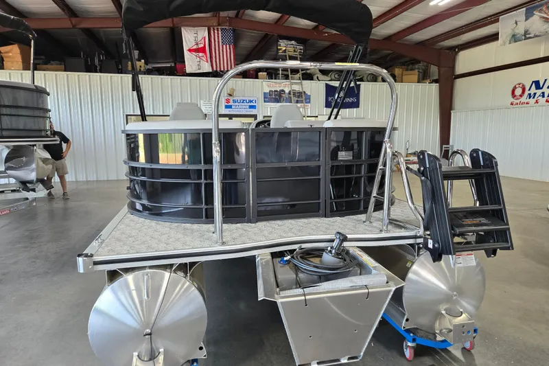 Slide: The Image of 2026 Trifecta 24RF LE 2.75 pontoon boat in showroom, featuring sleek design and modern amenities. - 18