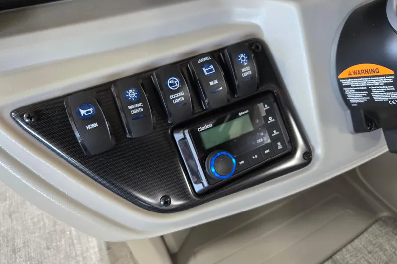 Slide: The Image of Control panel of 2026 Trifecta 24RF LE 2.75 with switches and audio system. - 8