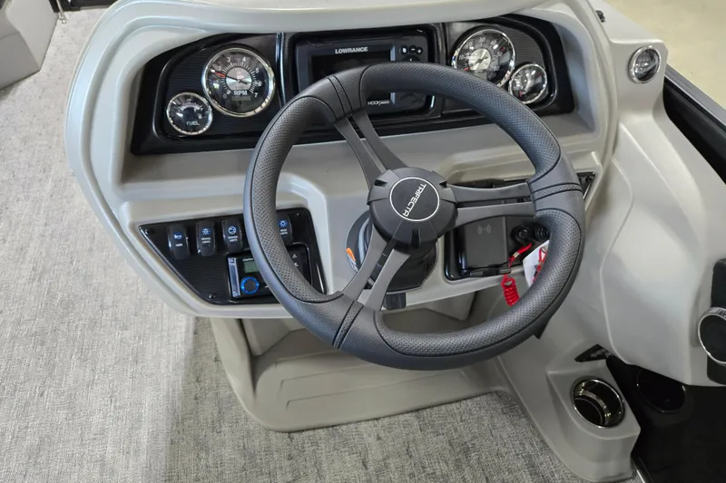 Slide: The Image of Steering console of 2026 Trifecta 24RF LE 2.75 pontoon boat with gauges and controls. - 9