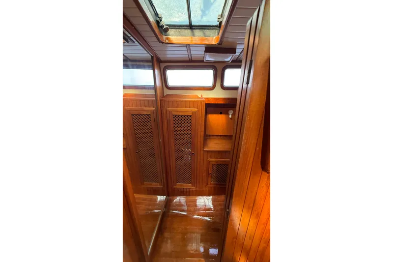 Slide: The Image of Interior of 1986 Westwind 38 sailboat with wooden cabinetry and skylight. - 15