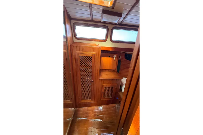 Slide: The Image of Interior of 1986 Westwind 38 sailboat with wooden cabinetry and windows. - 18