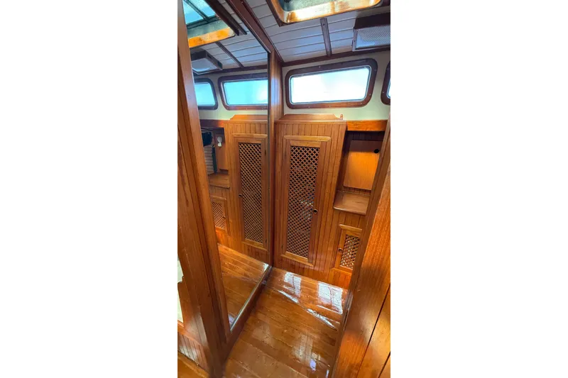Slide: The Image of Interior of 1986 Westwind 38 sailboat with wooden cabinetry and natural light. - 20