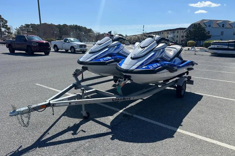 Slide: The Image of Two 2023 Yamaha WaveRunner FX SHO jet skis on a trailer in a parking lot. - 3