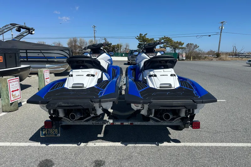 Slide: The Image of 2023 Yamaha WaveRunner FX SHO jet skis on a trailer in a parking lot. - 5