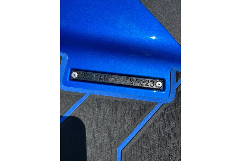 Slide: The Image of 2023 Yamaha WaveRunner FX SHO hull identification number on blue surface. - 6