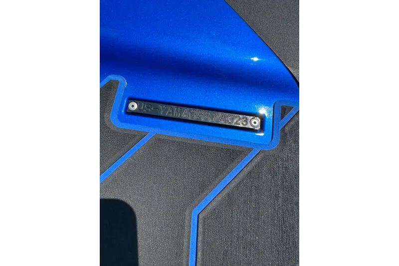 Slide: The Image of 2023 Yamaha WaveRunner FX SHO hull identification number on blue surface. - 7