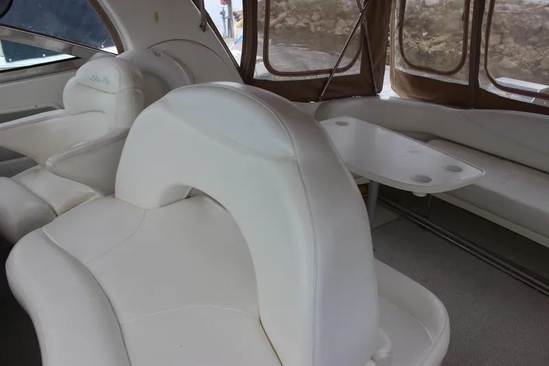 Slide: The Image of Interior of 2001 Sea Ray 380 Sundancer with white leather seating and table. - 11