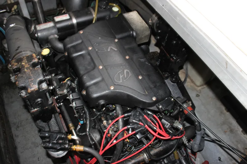Slide: The Image of Engine compartment of a 2001 Sea Ray 380 Sundancer boat, featuring detailed components. - 17