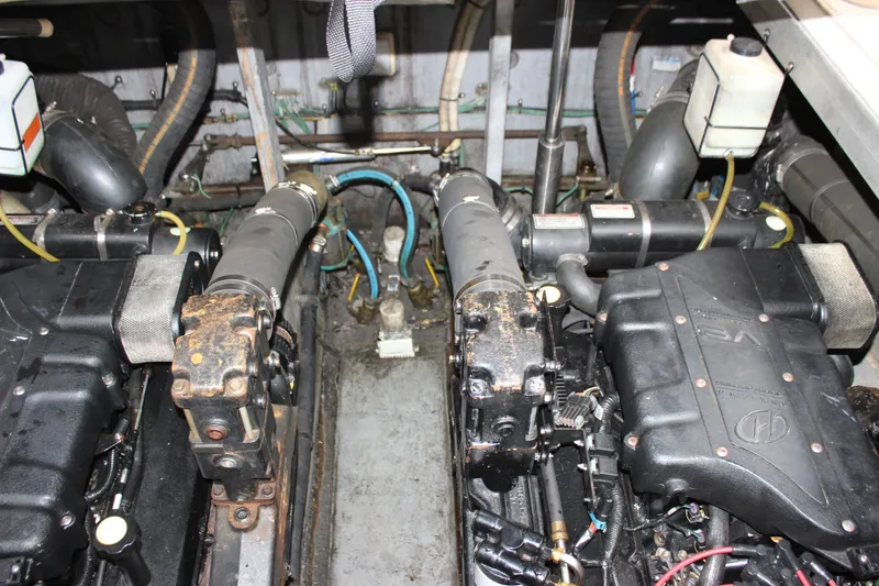 Slide: The Image of Engine compartment of a 2001 Sea Ray 380 Sundancer boat, showing dual engines and components. - 18