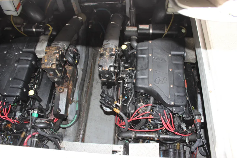 Slide: The Image of Engine compartment of a 2001 Sea Ray 380 Sundancer boat, showing dual engines. - 19