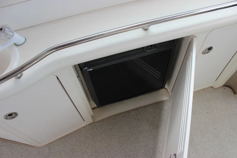 Slide: The Image of 2001 Sea Ray 380 Sundancer interior with mini fridge and sink. - 20
