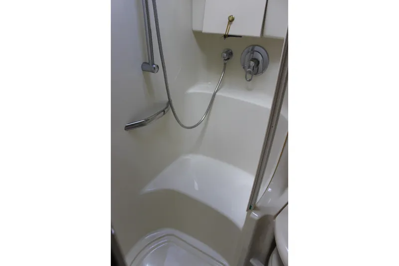 Slide: The Image of Shower area in 2001 Sea Ray 380 Sundancer yacht, featuring modern fixtures and compact design. - 25