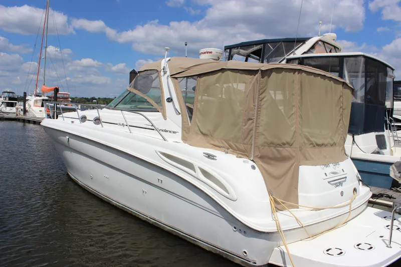 Slide: The Image of 2001 Sea Ray 380 Sundancer yacht docked at marina under blue sky. - 4