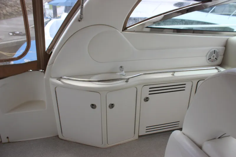 Slide: The Image of 2001 Sea Ray 380 Sundancer interior with white cabinetry and seating. - 7