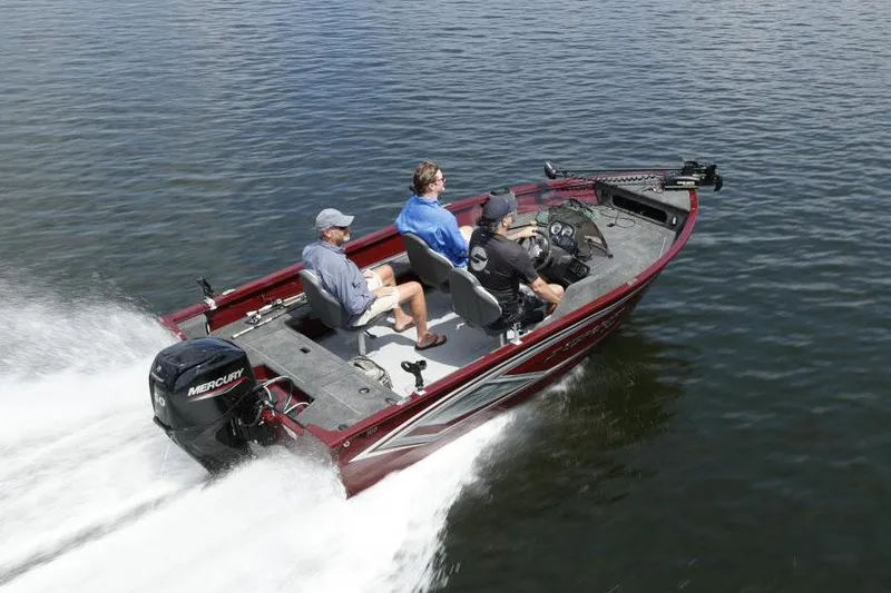 Slide: The Image of Manufacturer Provided Image: 2023 Starcraft Storm 176 SC boat with three people cruising on water. - 7