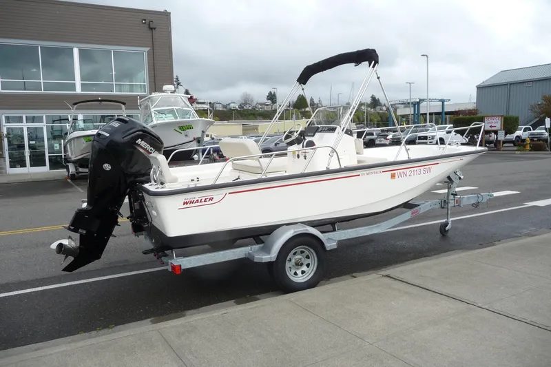 The Image of 2020 Boston Whaler 170 Dauntless boat on trailer, parked outside dealership. - 0