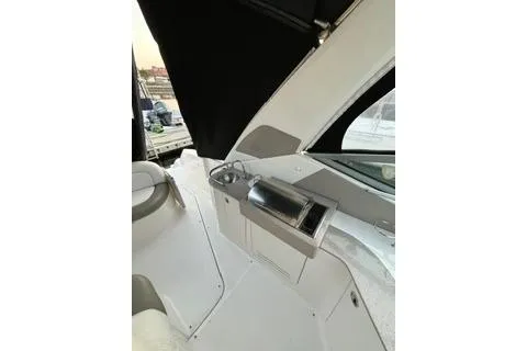 Slide: The Image of 2007 Sea Ray Sundancer 310 interior with sleek design and modern amenities. - 10