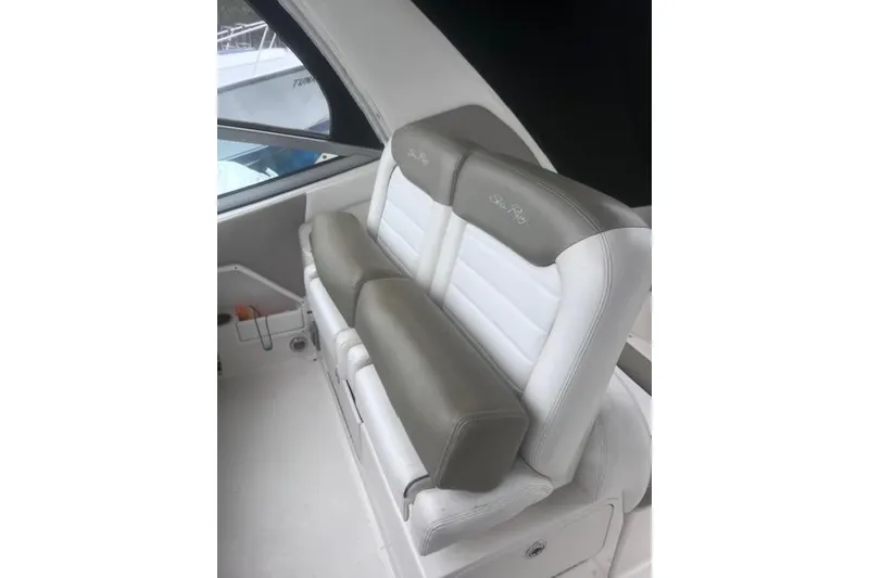 Slide: The Image of 2007 Sea Ray Sundancer 310 boat interior with cushioned seating. - 14