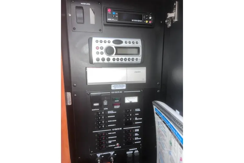 Slide: The Image of Control panel of a 2007 Sea Ray Sundancer 310 boat, featuring various switches and displays. - 17