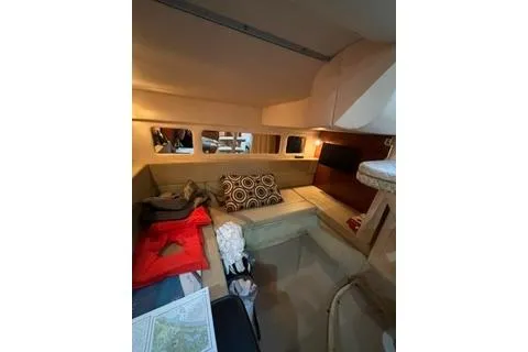 Slide: The Image of Interior cabin of 2007 Sea Ray Sundancer 310 with cozy seating and decorative pillows. - 18