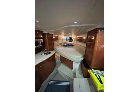 Slide: The Image of 2007 Sea Ray Sundancer 310 cabin interior with wood finish and modern amenities. - 23