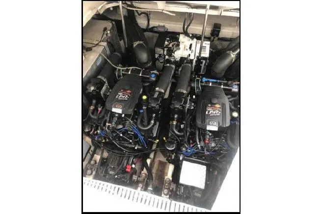 Slide: The Image of Engine compartment of a 2007 Sea Ray Sundancer 310 boat, featuring dual engines. - 26