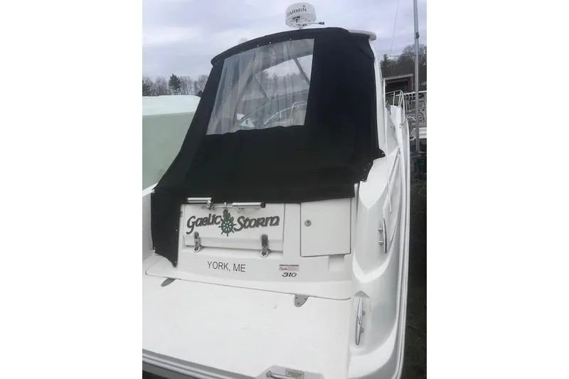 Slide: The Image of 2007 Sea Ray Sundancer 310 boat with black cover, docked in York, ME. - 3