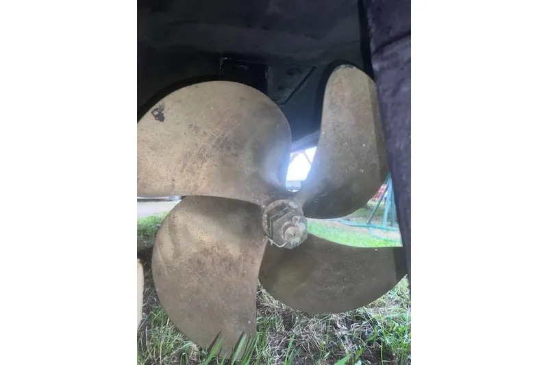 Slide: The Image of Propeller of 2007 Sea Ray Sundancer 310 boat on grass. - 30
