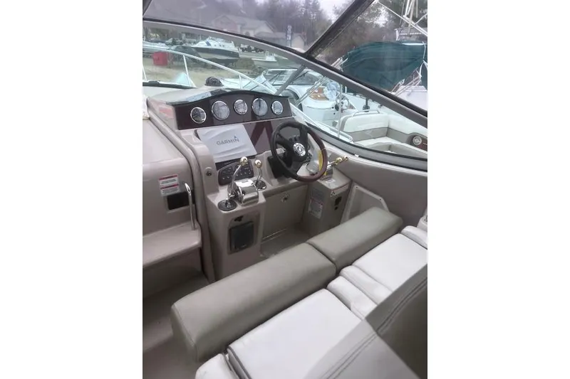 Slide: The Image of 2007 Sea Ray Sundancer 310 cockpit with Garmin navigation, steering wheel, and control panel. - 5