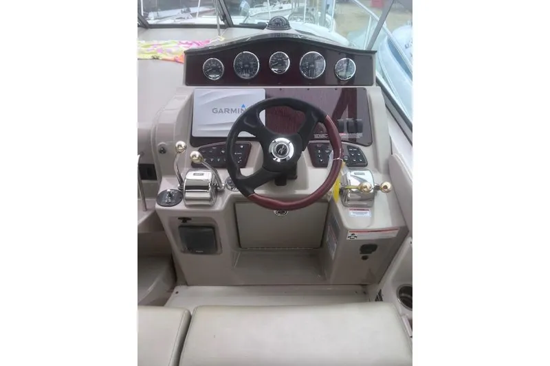 Slide: The Image of Helm of 2007 Sea Ray Sundancer 310 with steering wheel and Garmin navigation system. - 6