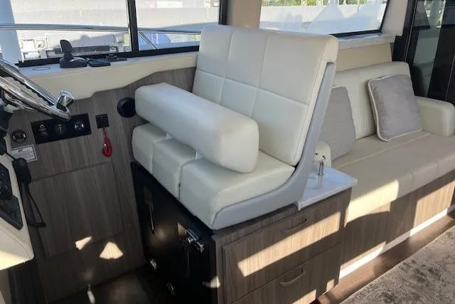 Slide: The Image of Interior of 2022 Regal 38 XO yacht with white leather seating and modern design. - 12