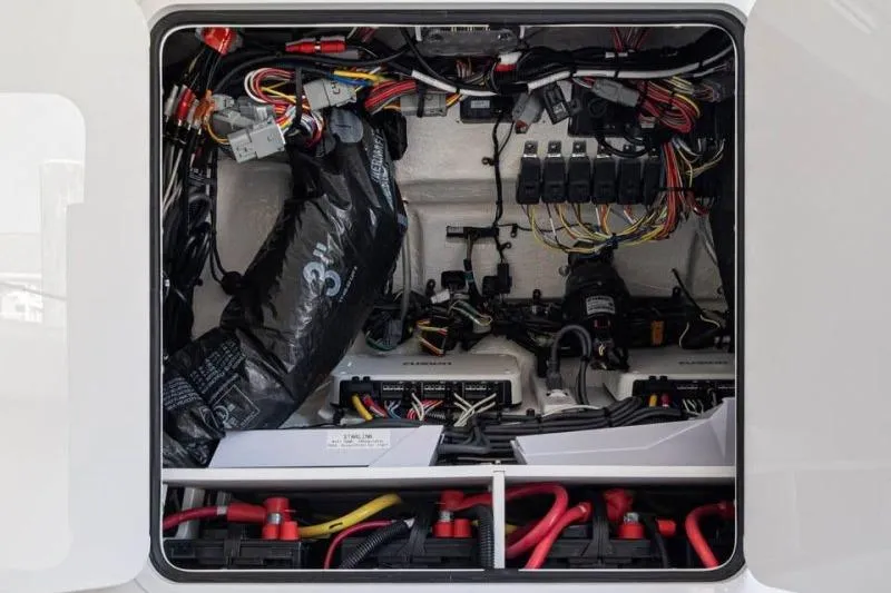 Slide: The Image of Electrical wiring and components inside a 2024 Regulator 34 boat. - 13