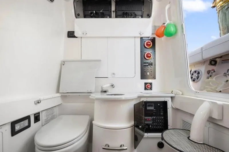 Slide: The Image of 2024 Regulator 34 boat interior with modern amenities and control panel. - 8