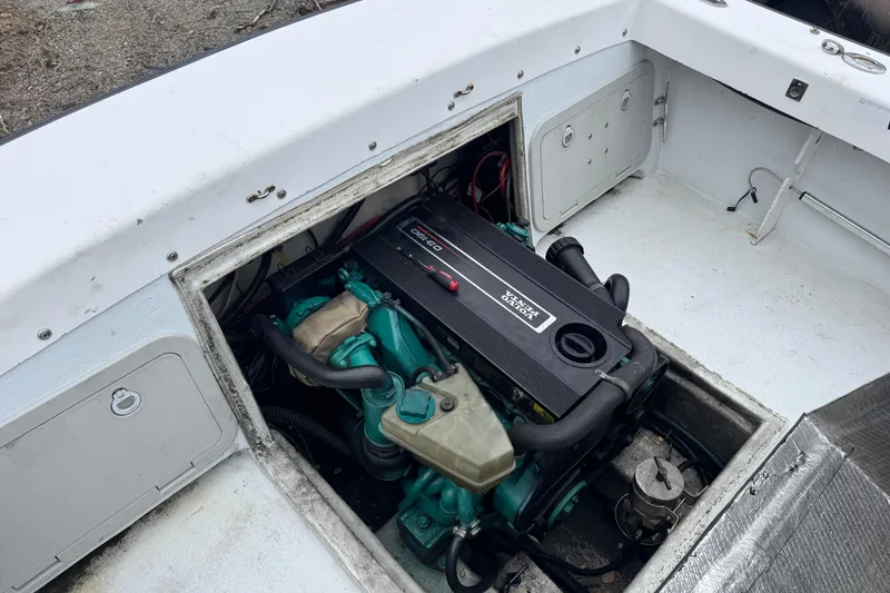 Slide: The Image of Engine compartment of a 2001 Eastern Lobsterman 27 boat, showcasing a diesel engine. - 14