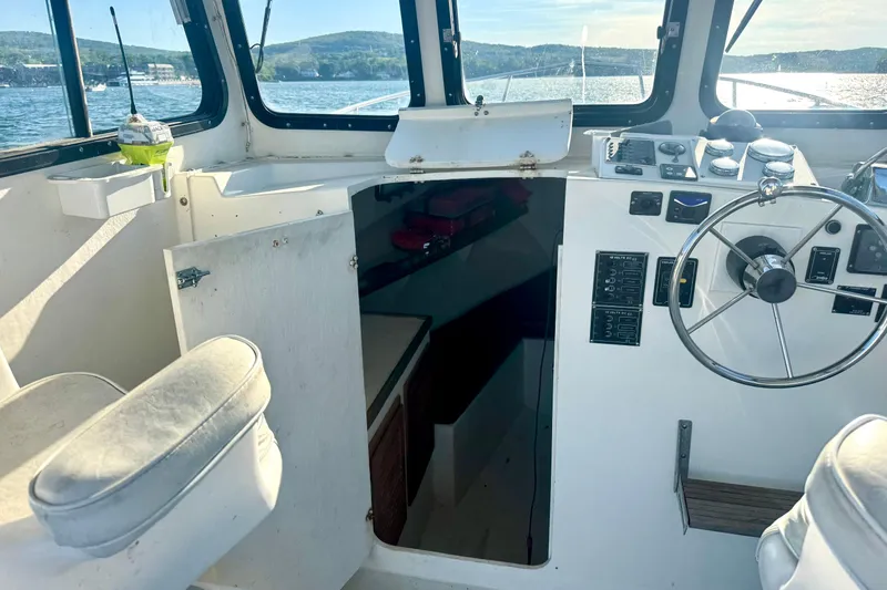 Slide: The Image of 2001 Eastern Lobsterman 27 boat named "Why Knot" on trailer, rear view. - 17