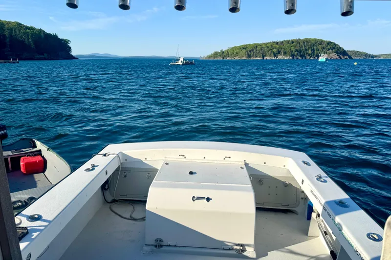 Slide: The Image of 2001 Eastern 27 Lobster Fisherman boat on calm blue waters with scenic island view. - 18