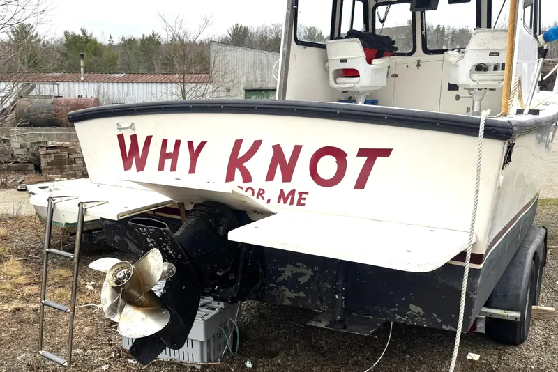 Slide: The Image of 2001 Eastern Lobsterman 27 boat named "Why Knot" on trailer, rear view. - 4