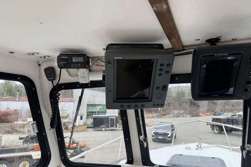 Slide: The Image of Interior of a 2001 Eastern Lobsterman 27 boat with navigation equipment. - 6